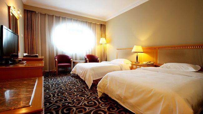 Modern Hotel Harbin Habitación foto